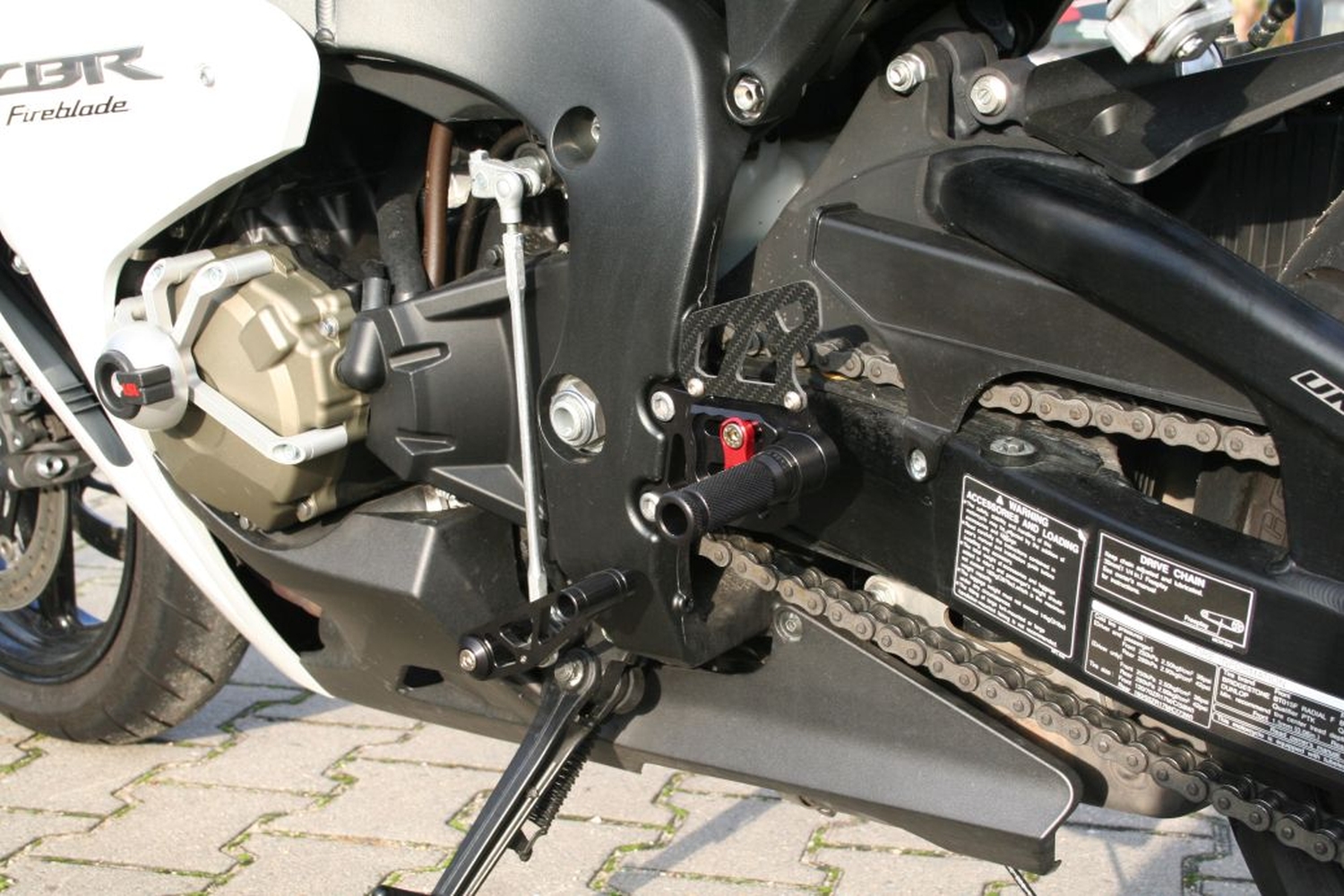 Sistema de estriberas LSL 2Slide para Honda CBR1000RR, 2008-, negro-rojo